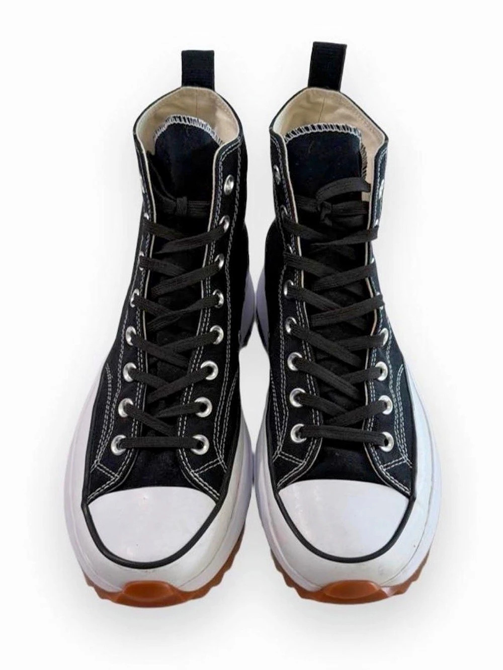 Black Converse Chuck Taylor All Star high top sneakers.